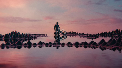 a man riding a motorcycle on top of a body of water