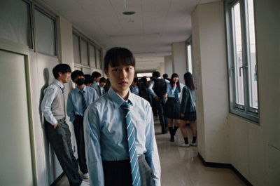 a group of young men standing next to each other in a hallway