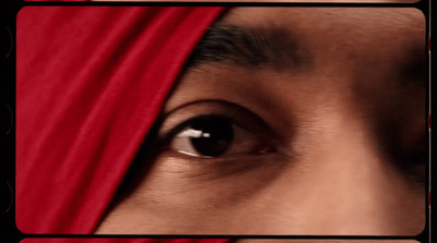 a close up of a person with a red head covering