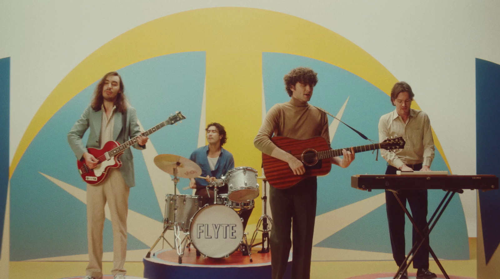 a group of people standing on top of a stage