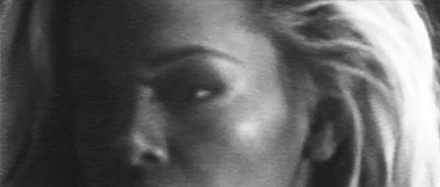 a black and white photo of a woman's face