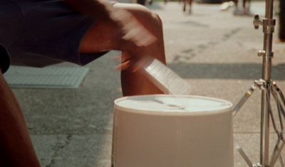 a person cutting a piece of paper with a knife