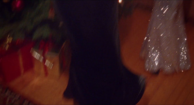 a blurry photo of a person walking on a wooden floor