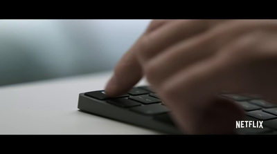 a close up of a person typing on a keyboard