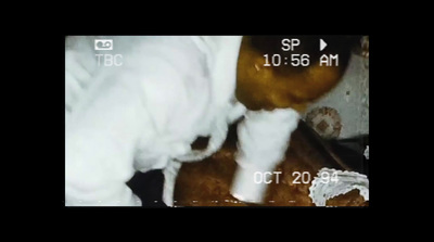 a close up of a person using a camera to take a picture of doughnut