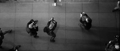 a group of people standing around each other