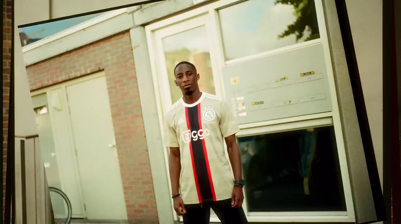 a man standing in front of a building