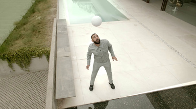 a man standing in front of a swimming pool