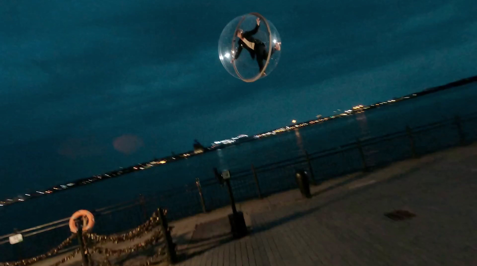 a person flying a kite over a body of water