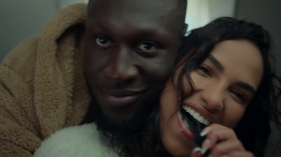 a man and a woman brushing their teeth