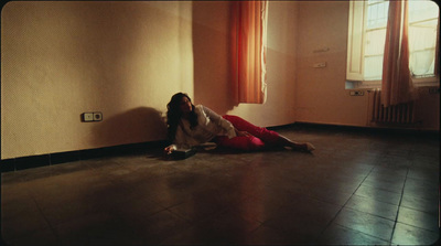 a woman sitting on the floor in a room