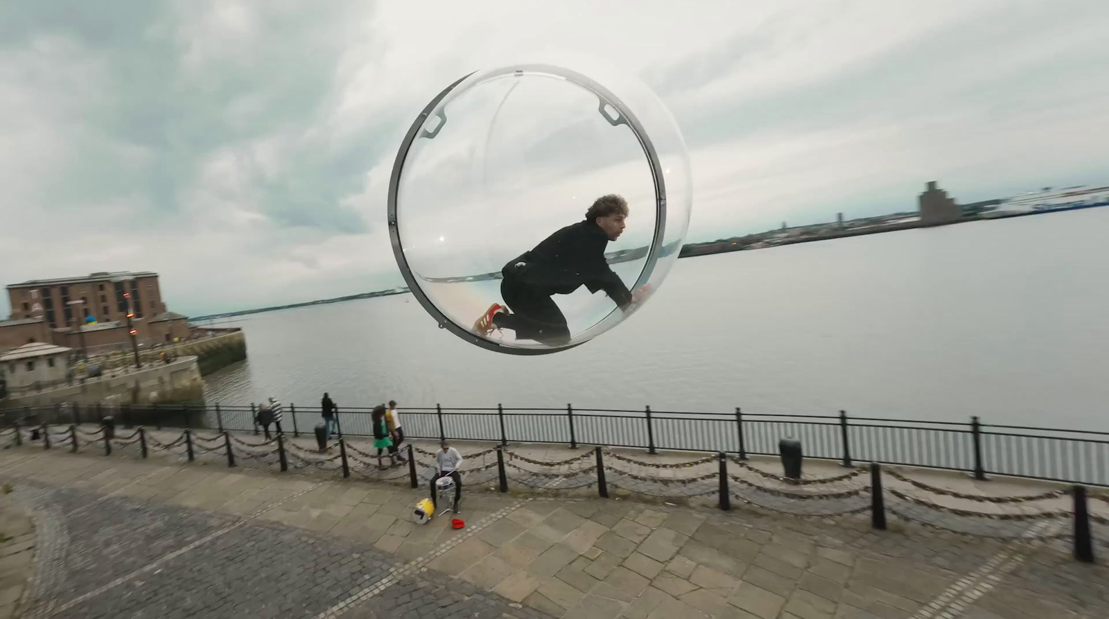 a man riding a skateboard through a bubble