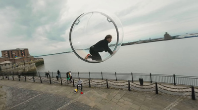 a man riding a skateboard through a bubble