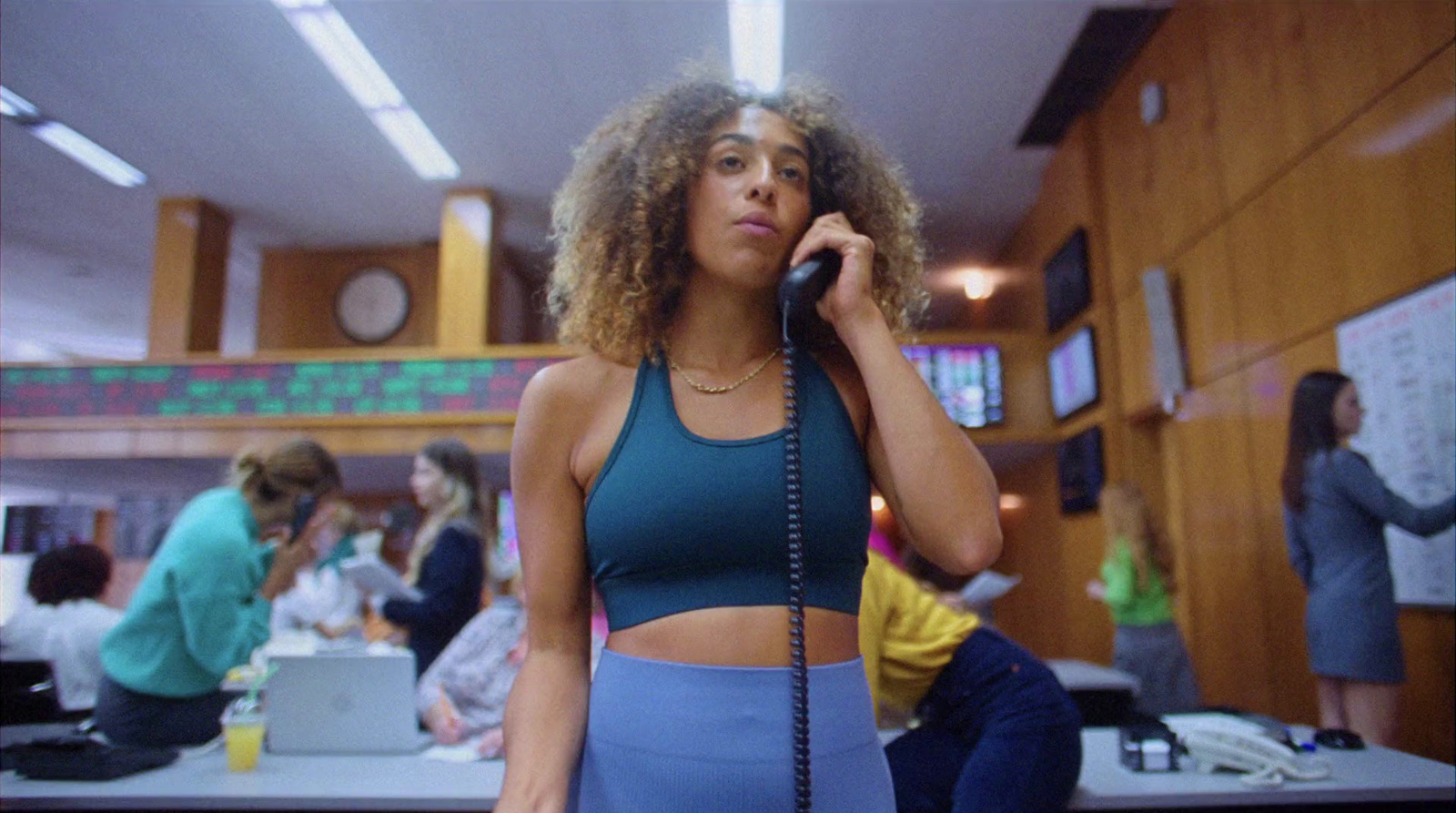 a woman talking on a phone in an office