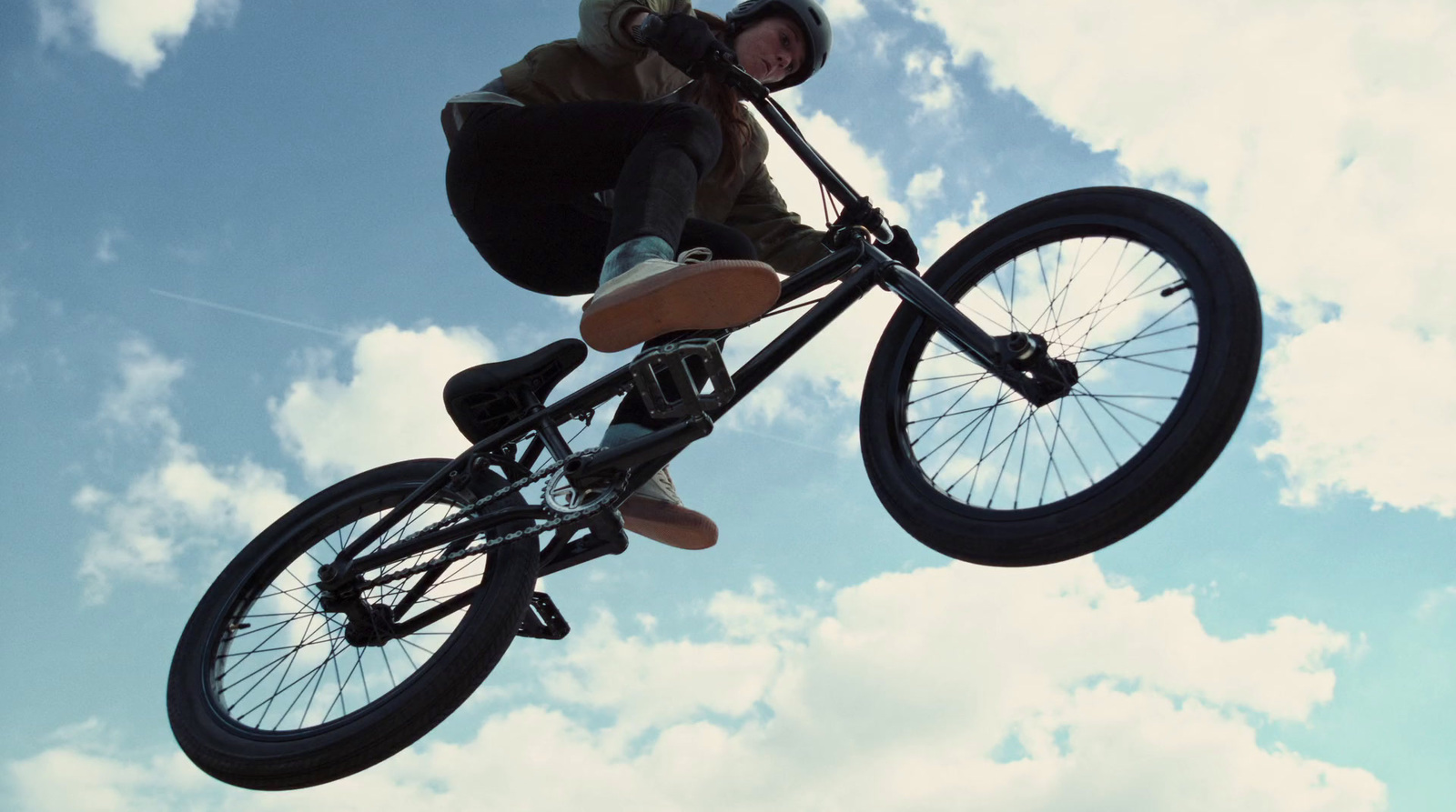 a man riding a bike up in the air