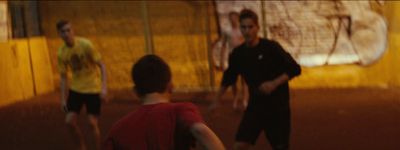 a group of young men playing a game of frisbee