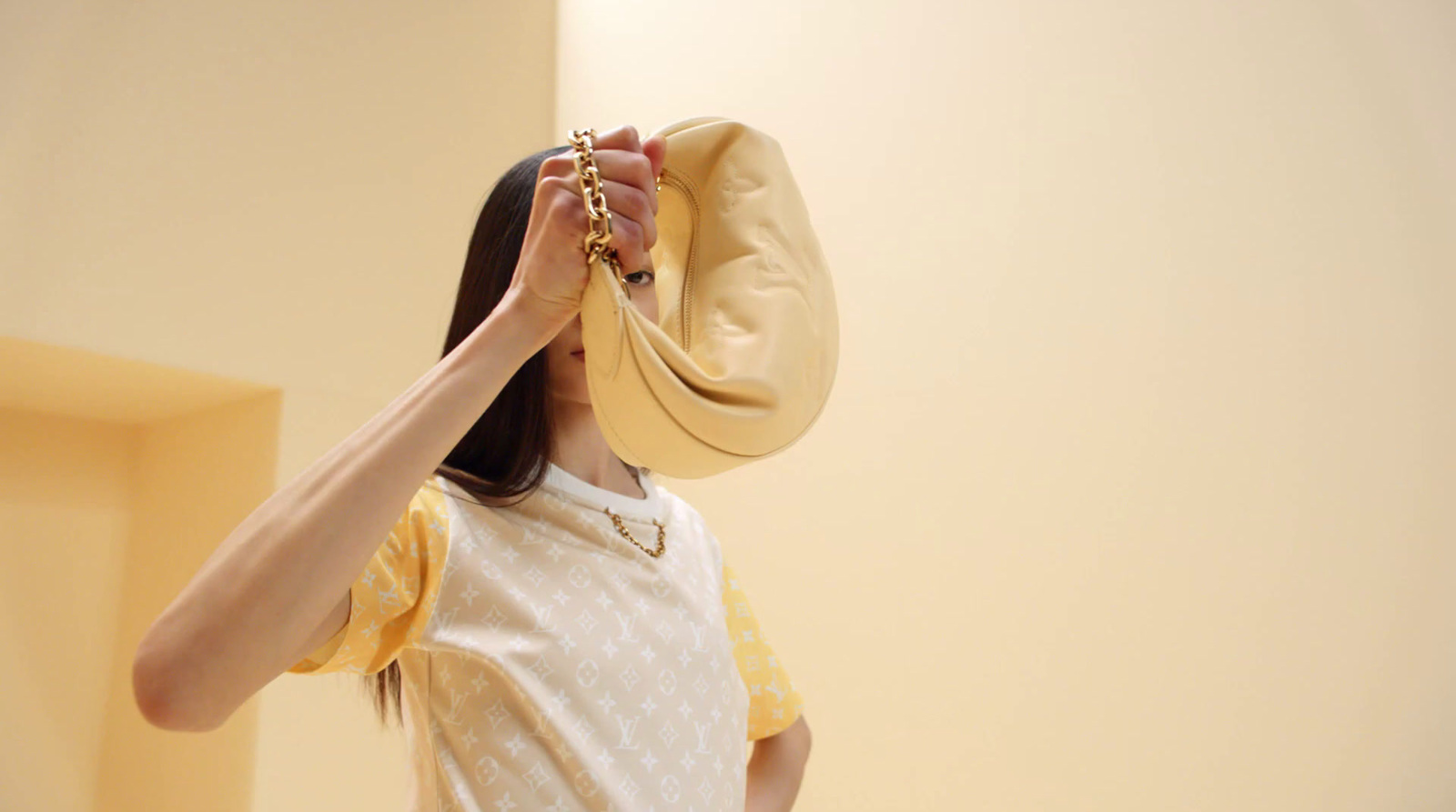 a woman wearing a yellow hat and a white dress