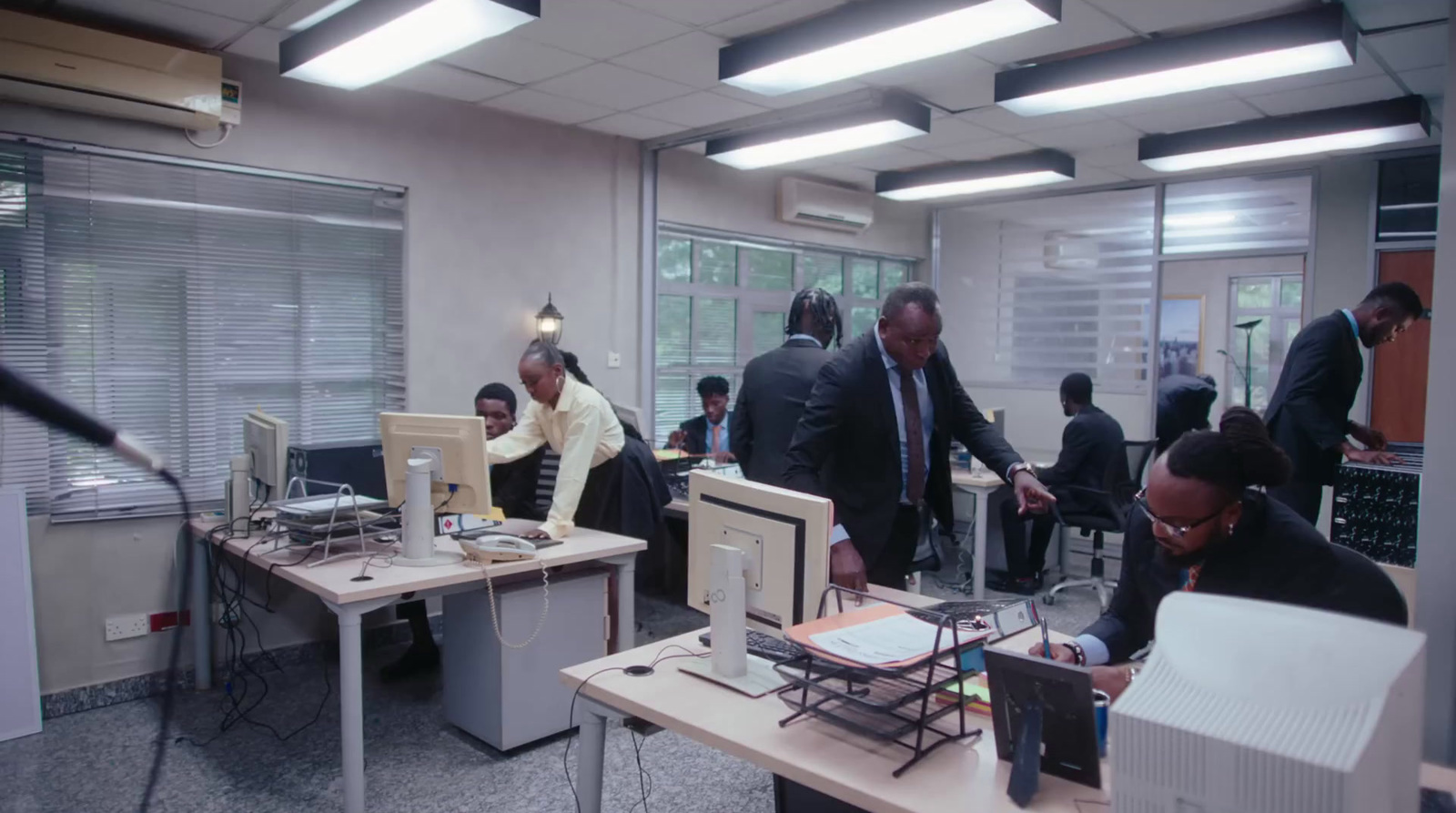 a group of people working in an office