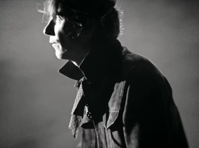 a black and white photo of a man in a shirt