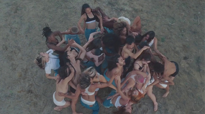 a group of women standing around each other