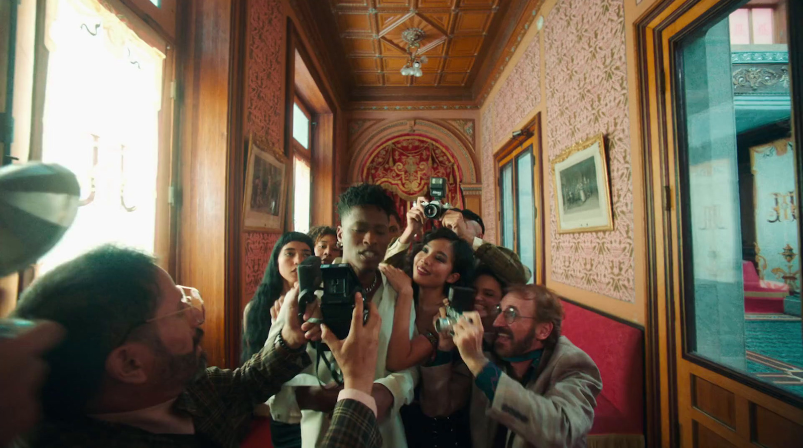 a group of people taking pictures in a room