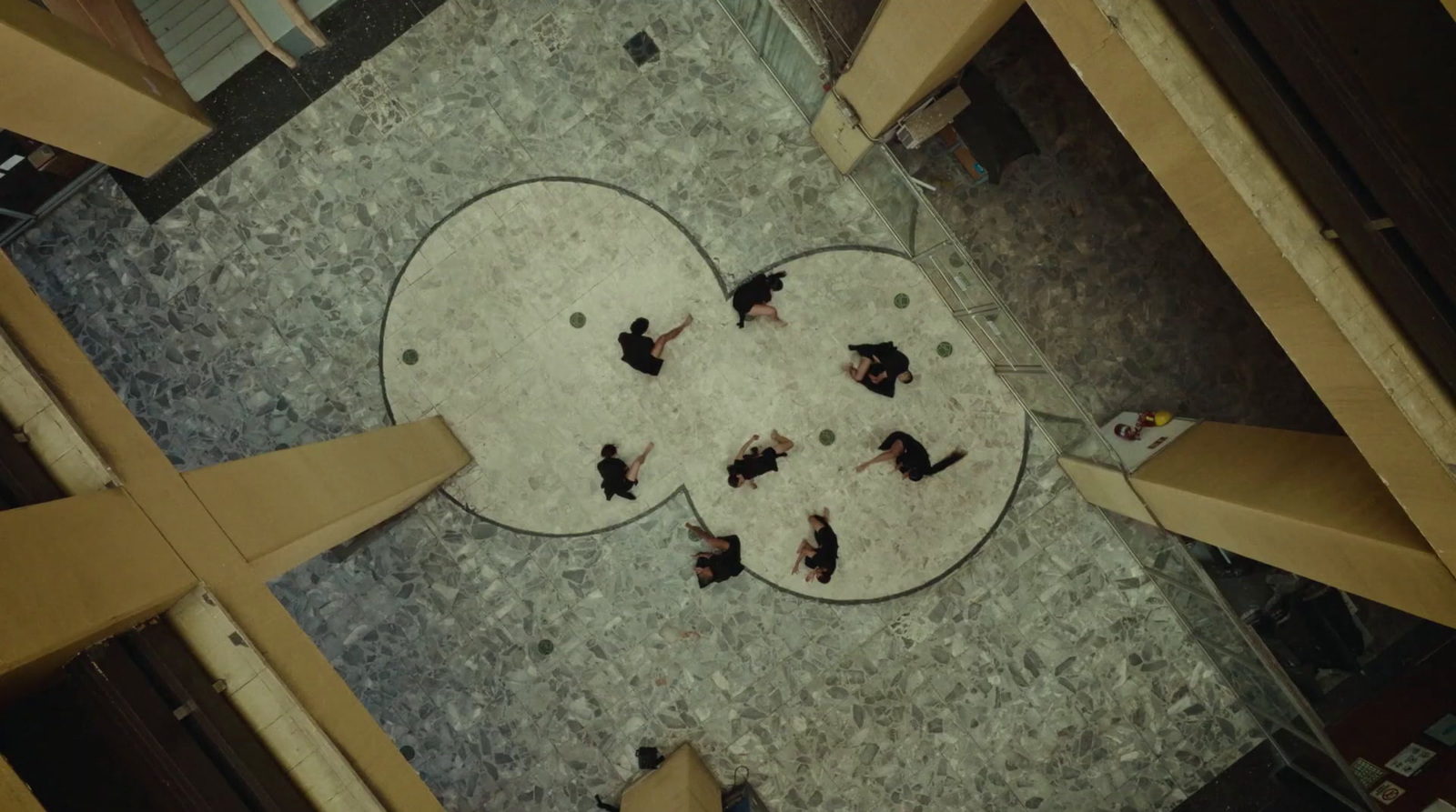 a group of people sitting on the floor of a building