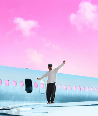 a man standing on the wing of an airplane