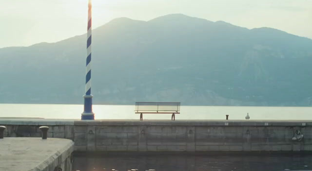 a bench sitting next to a body of water