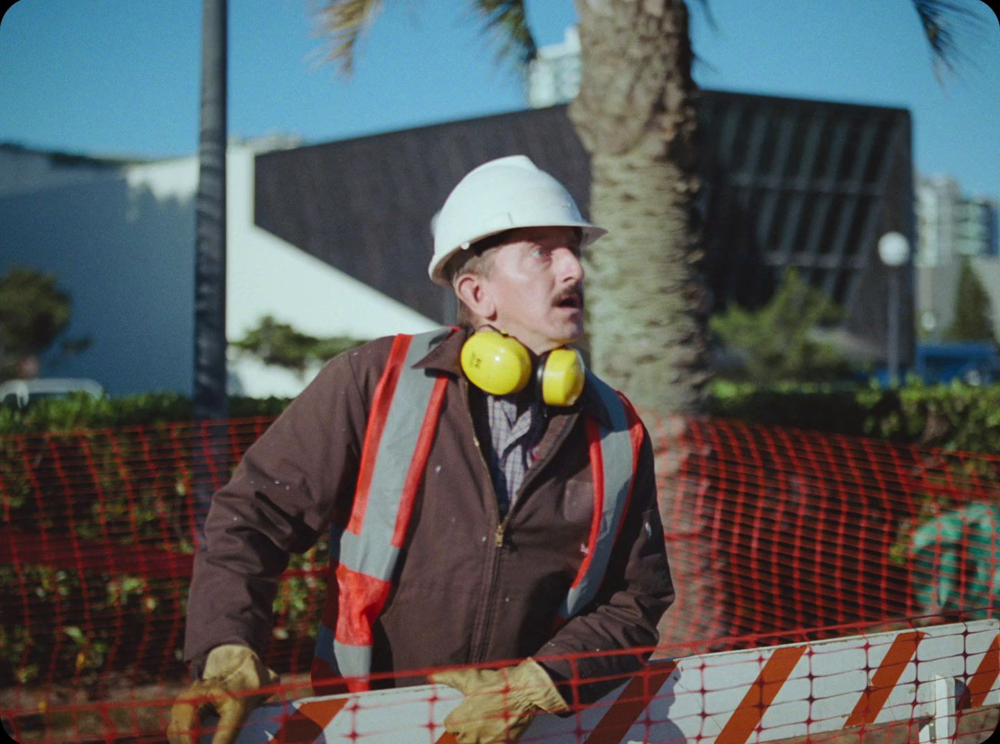 a man wearing a hard hat and safety gear