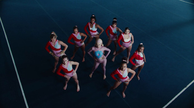 a group of women standing on top of a tennis court