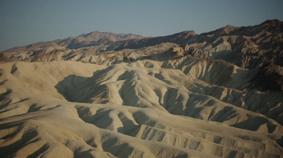 a view of a mountain range from an airplane