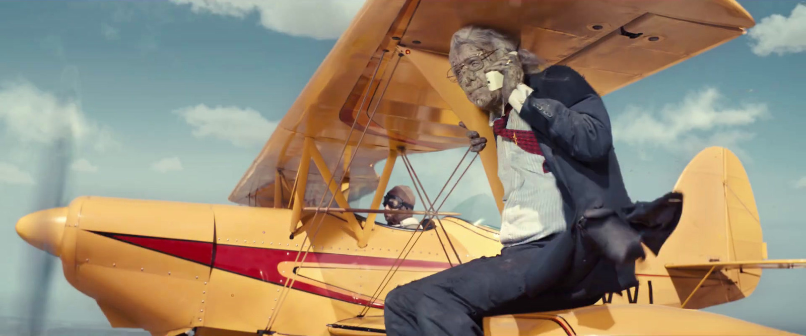 a man sitting on the wing of an airplane