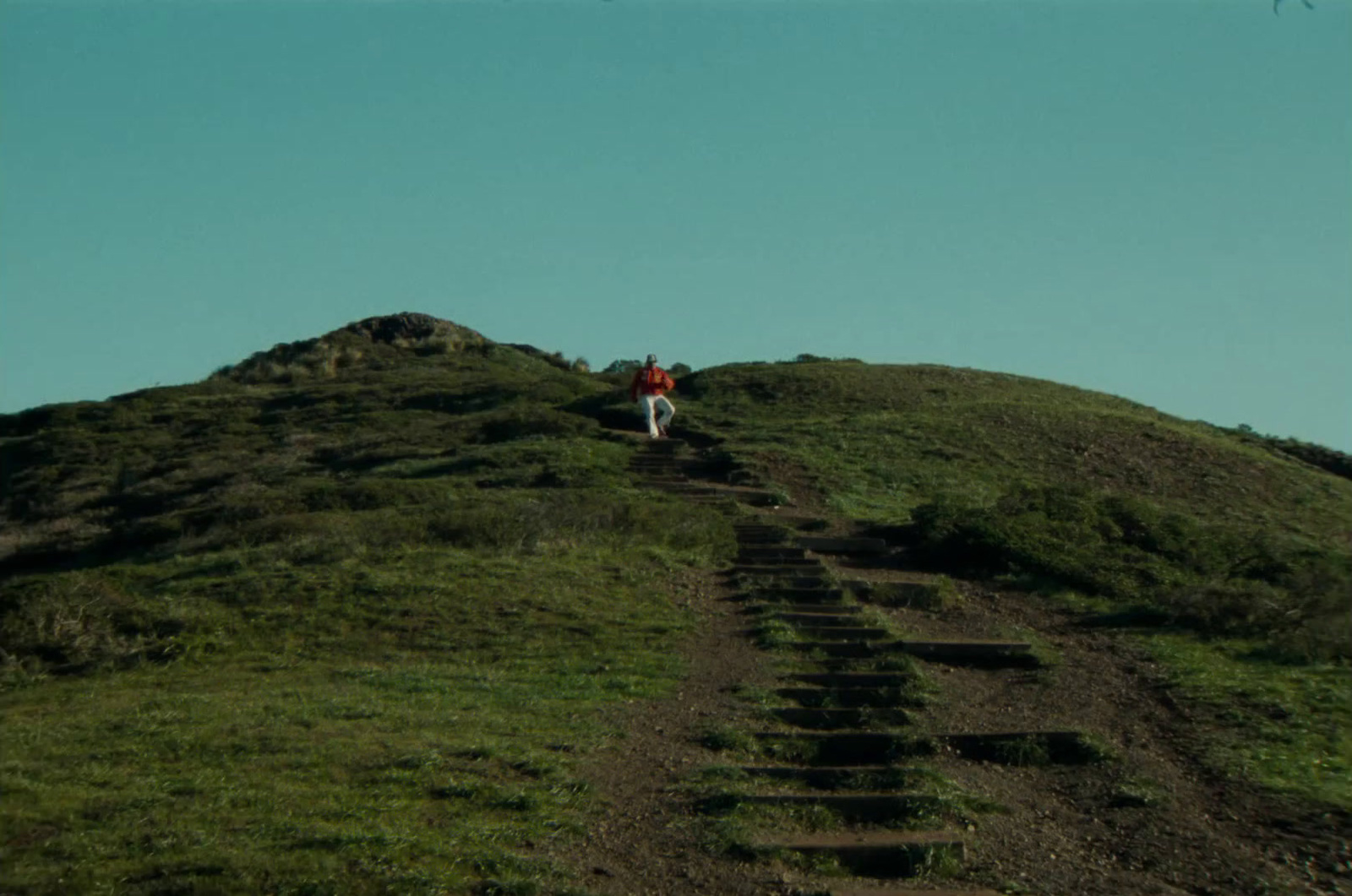 a person is walking up a steep hill