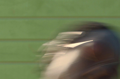 a blurry photo of a person riding a horse