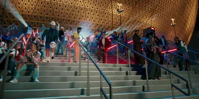 a group of people standing on top of a set of stairs