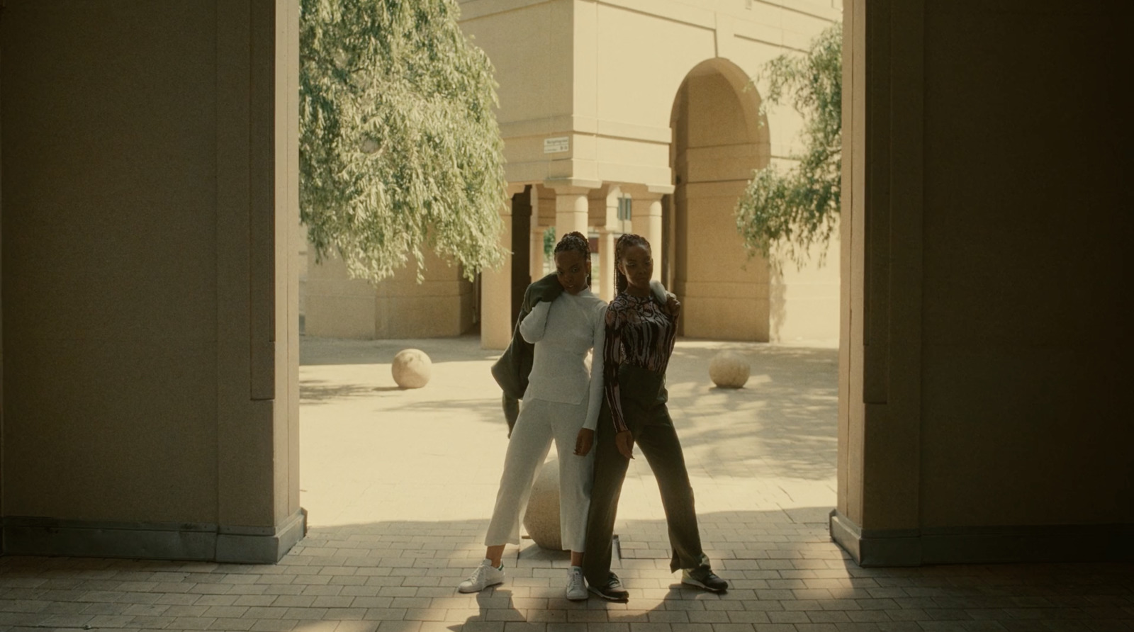 a couple of women standing next to each other