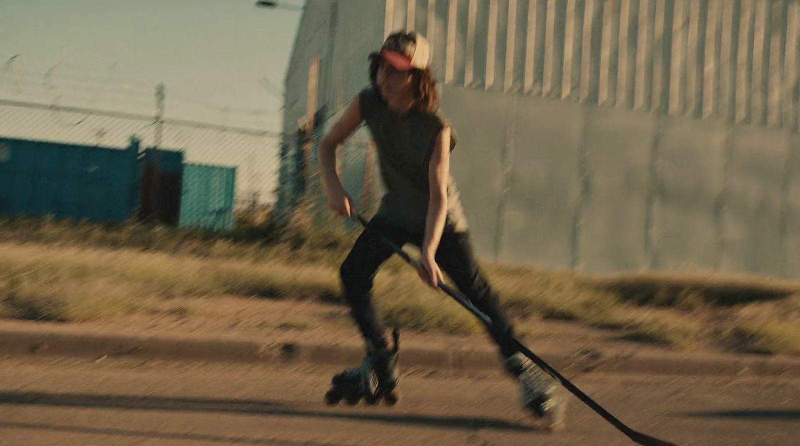 a man riding a skateboard down a street