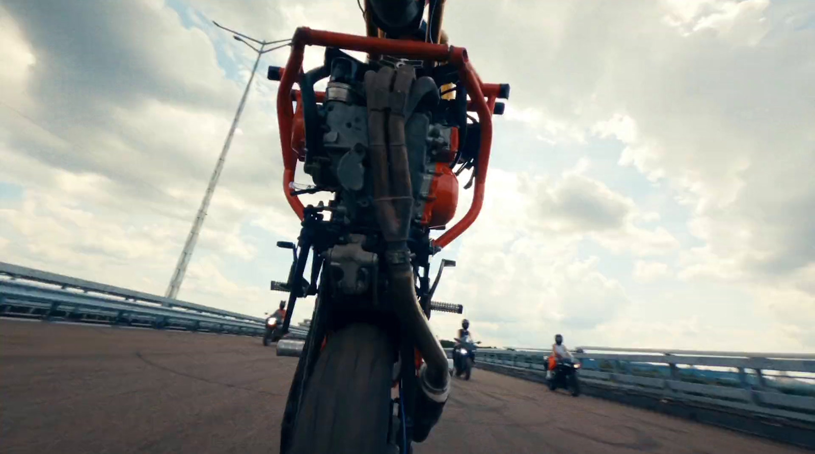 a person riding a bike on a bridge