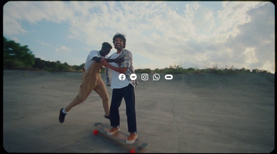 a man riding a skateboard next to another man on a skateboard