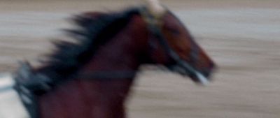 a blurry photo of a horse in motion