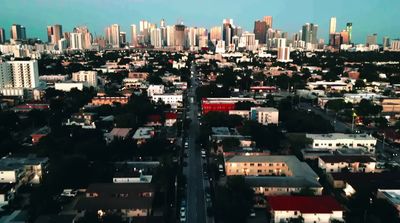 an aerial view of a city with tall buildings