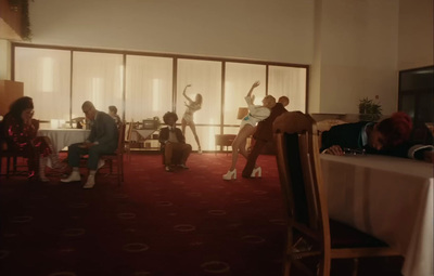 a group of people sitting at a table in a room