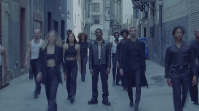 a group of people walking down a street