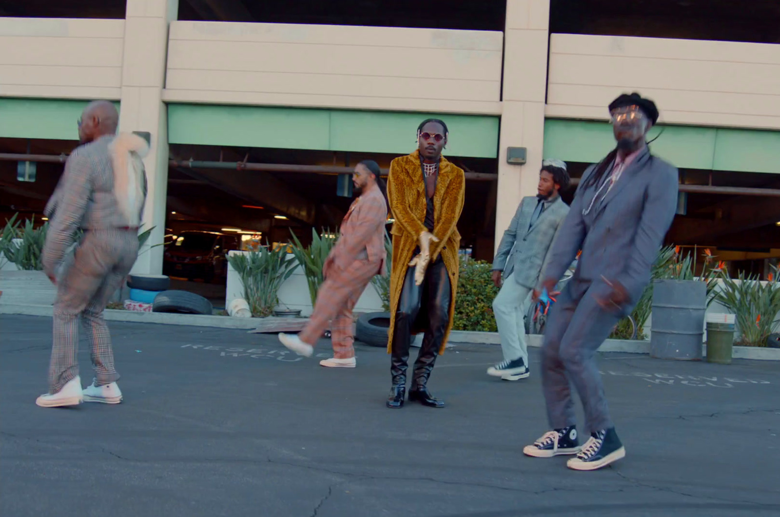 a group of people standing in front of a building