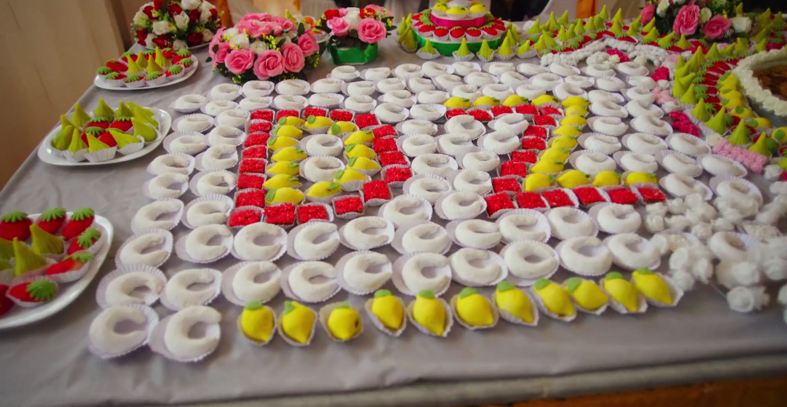 a table topped with lots of different types of desserts