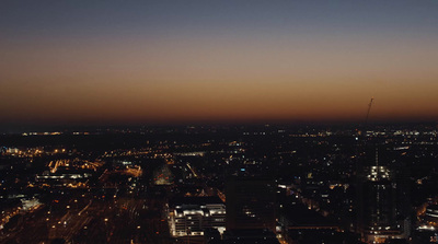 a view of a city at night from the top of a building