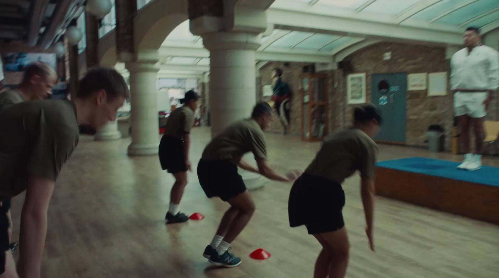 a group of young men playing a game of frisbee