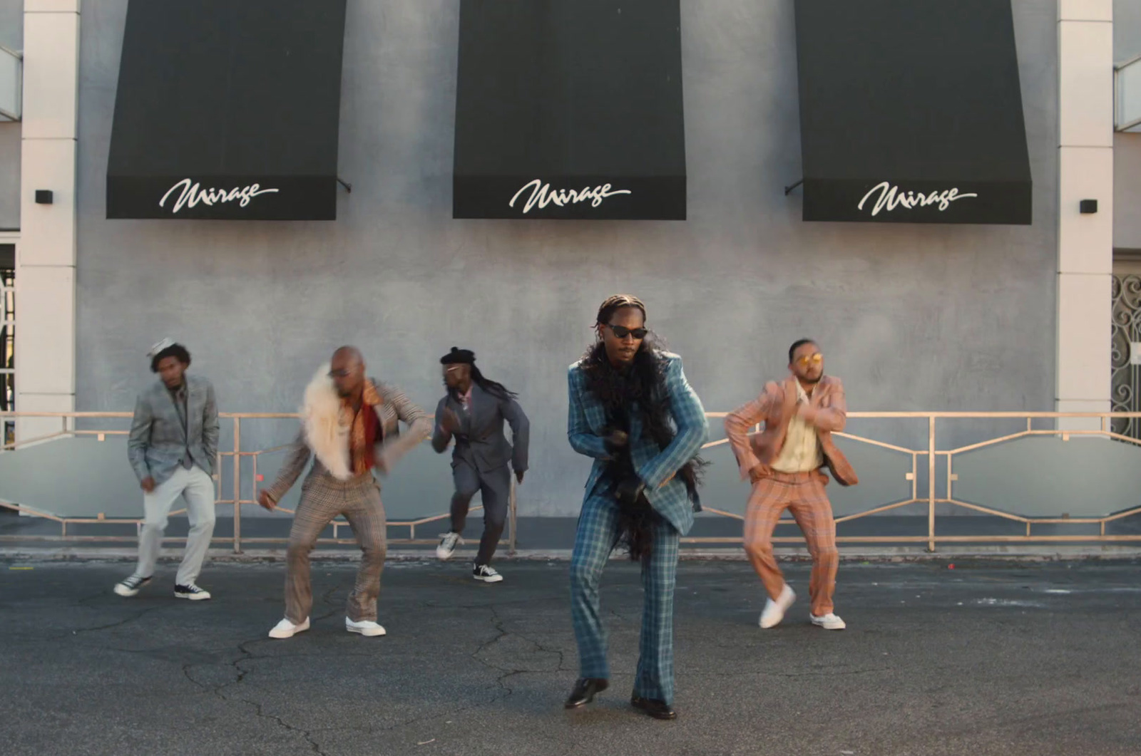 a group of people standing in front of a building