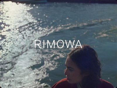 a woman sitting on a boat in the water