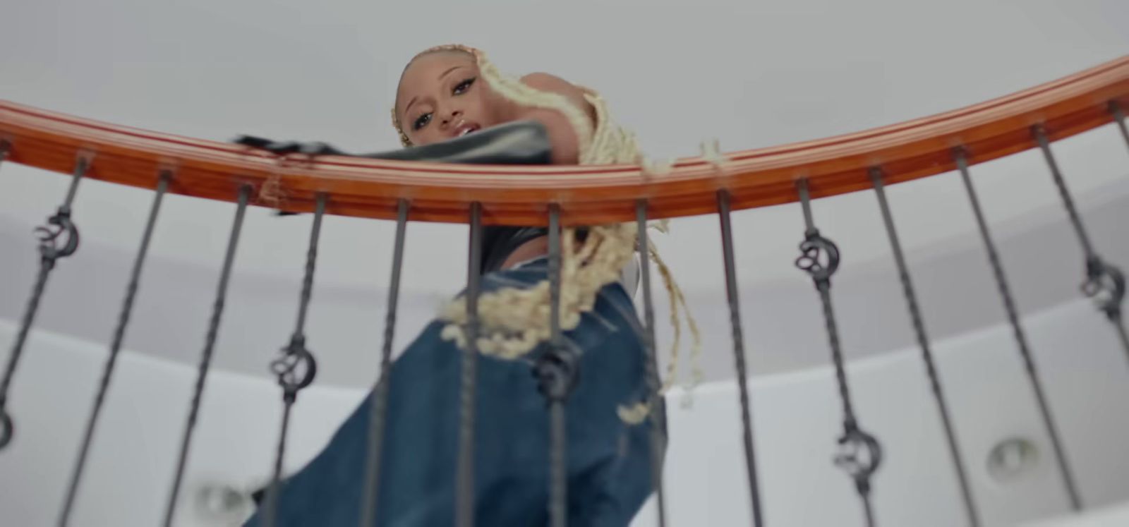 a doll sitting on top of a wooden boat